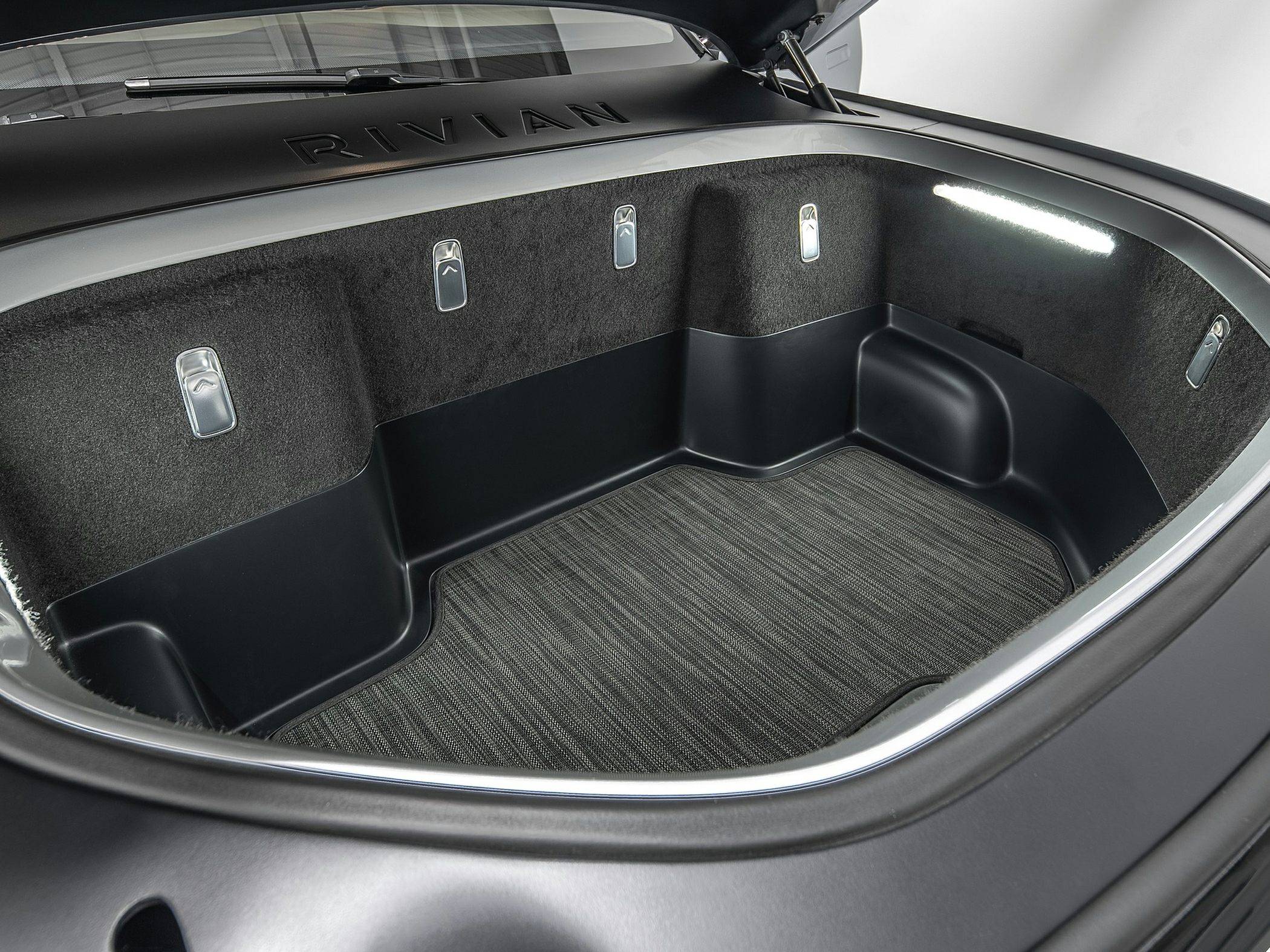 Large front trunk storage space with integrated light and sturdy lining