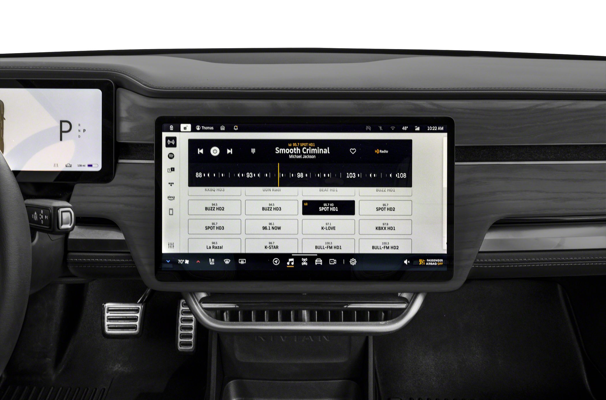 Touchscreen infotainment and digital instrument cluster inside modern vehicle interior