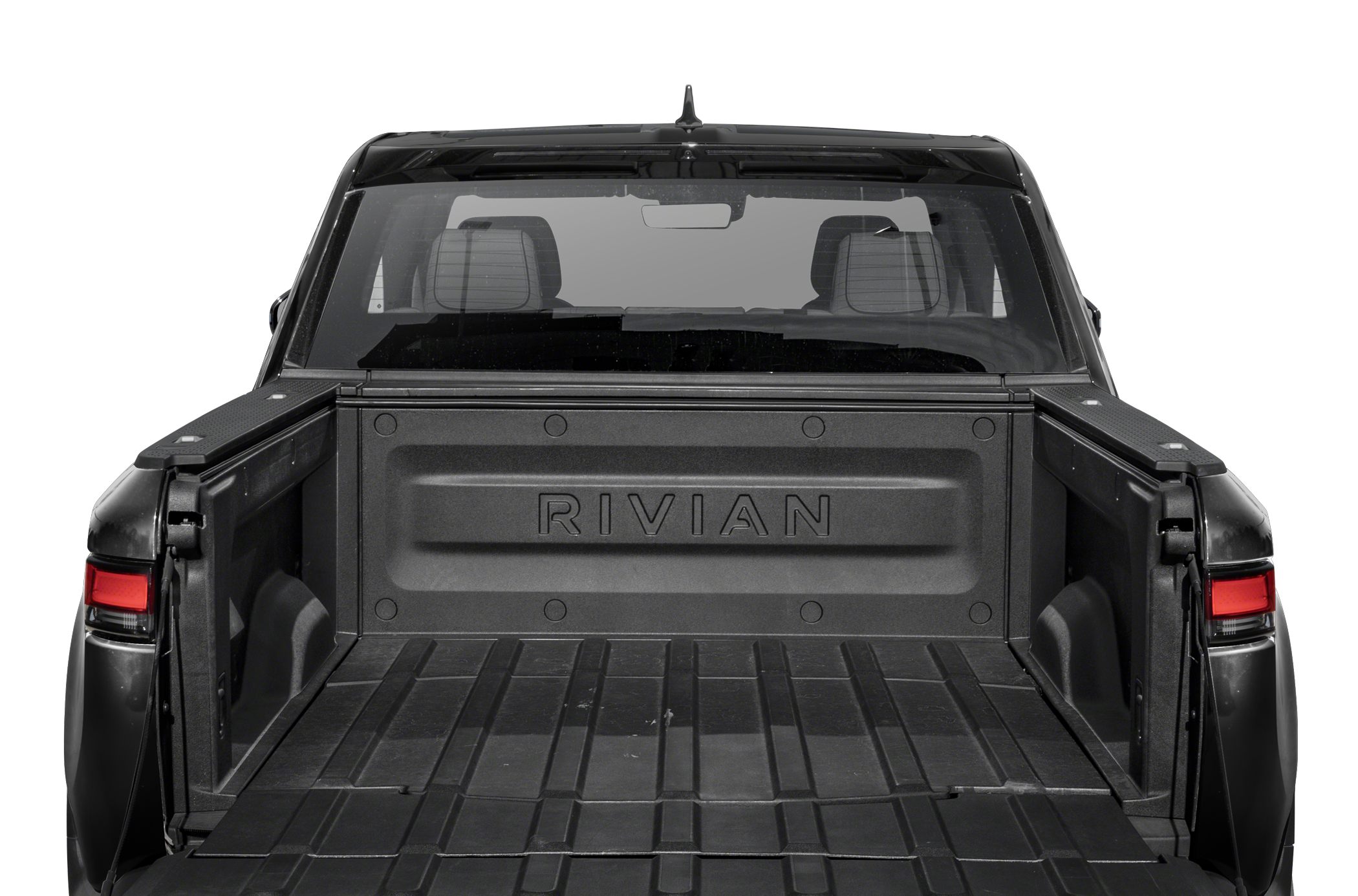 Spacious open pickup truck bed with integrated tailgate and embossed branding