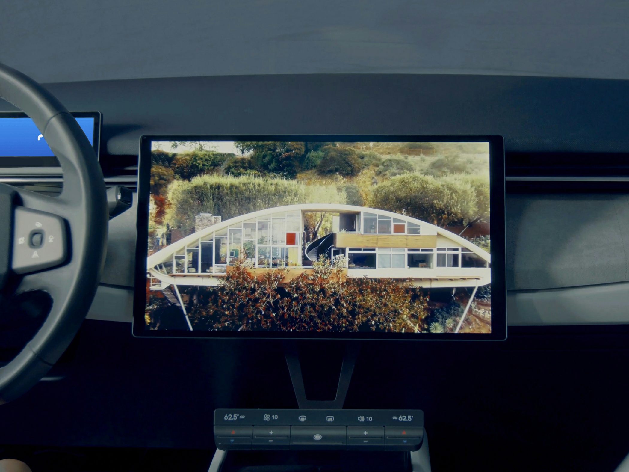 Digital infotainment display and climate control panel in car interior
