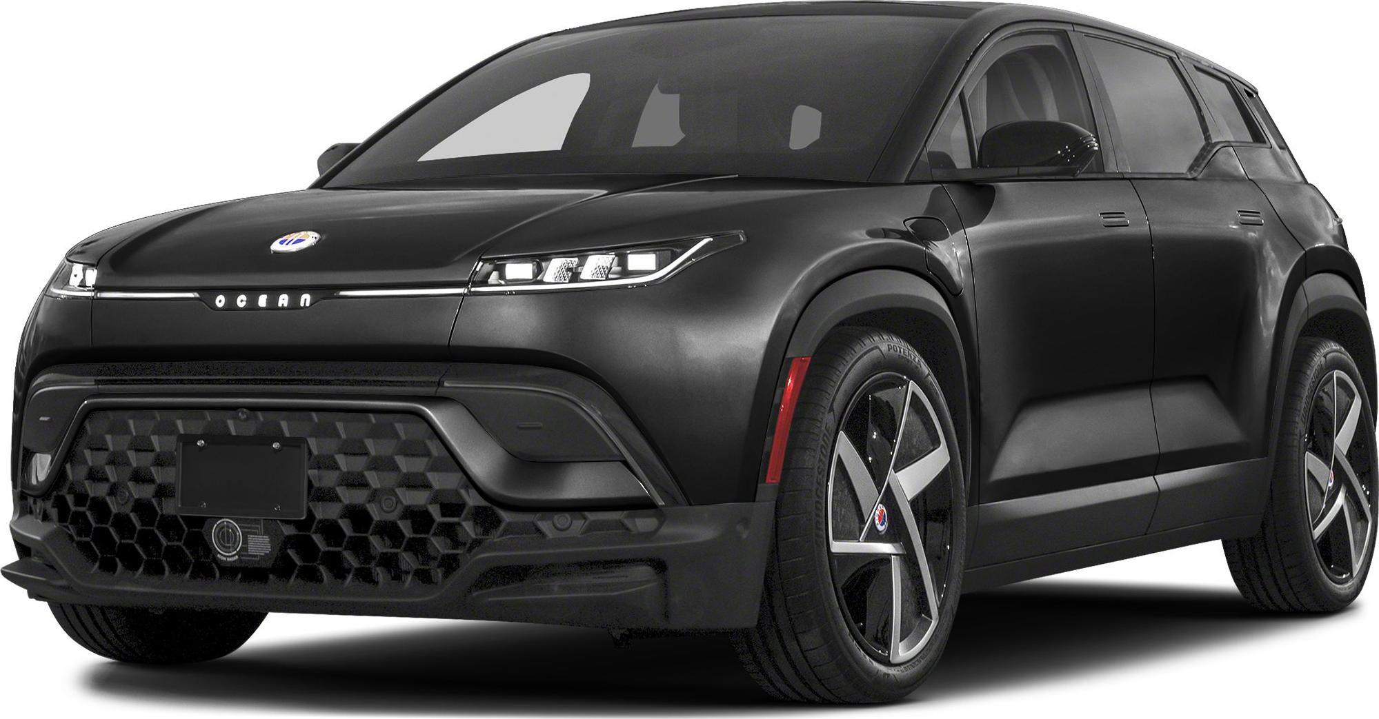 Front view of black electric SUV with LED headlights and hexagonal grille