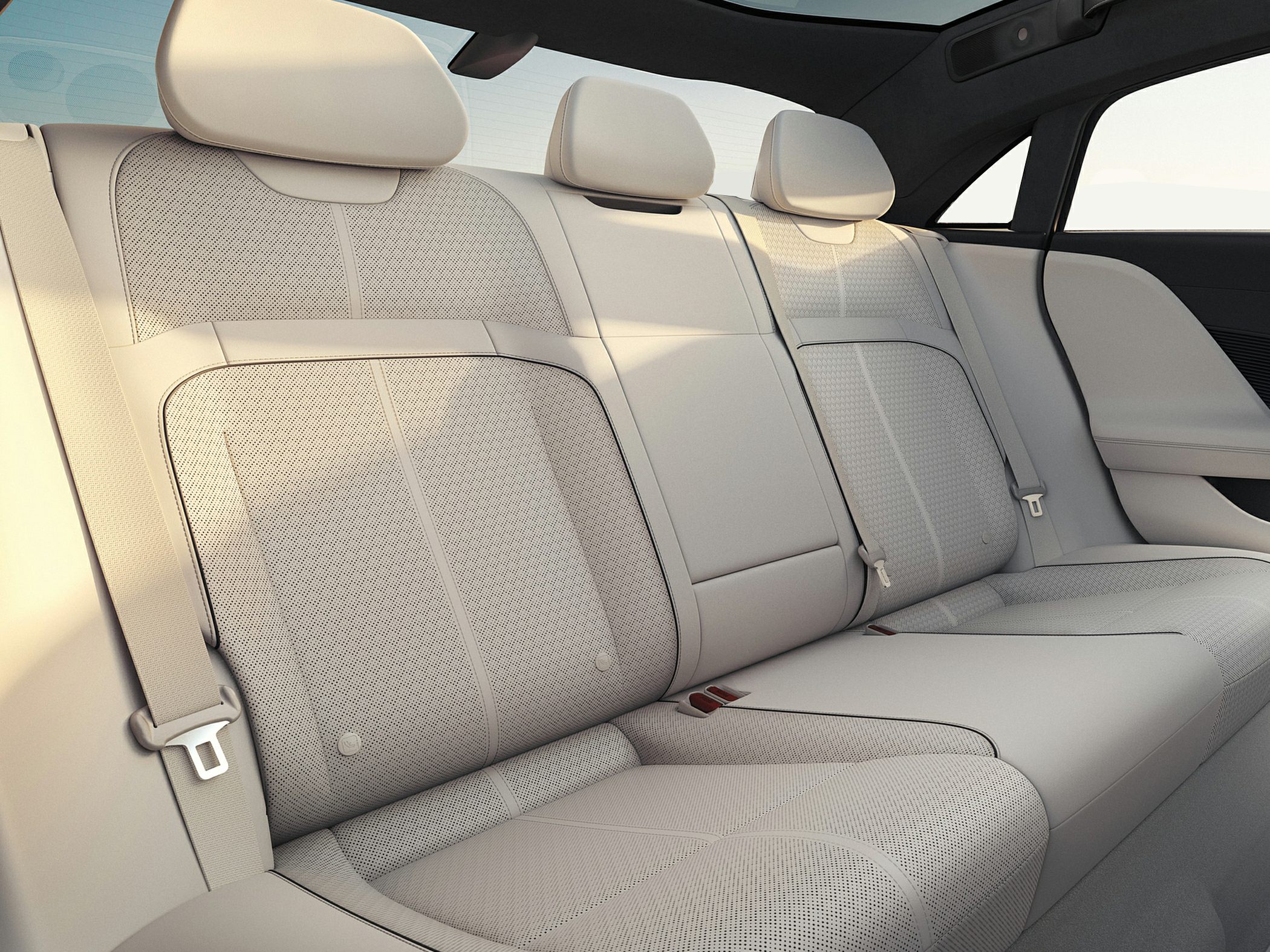 Luxurious rear seats with premium perforated leather upholstery and headrests.
