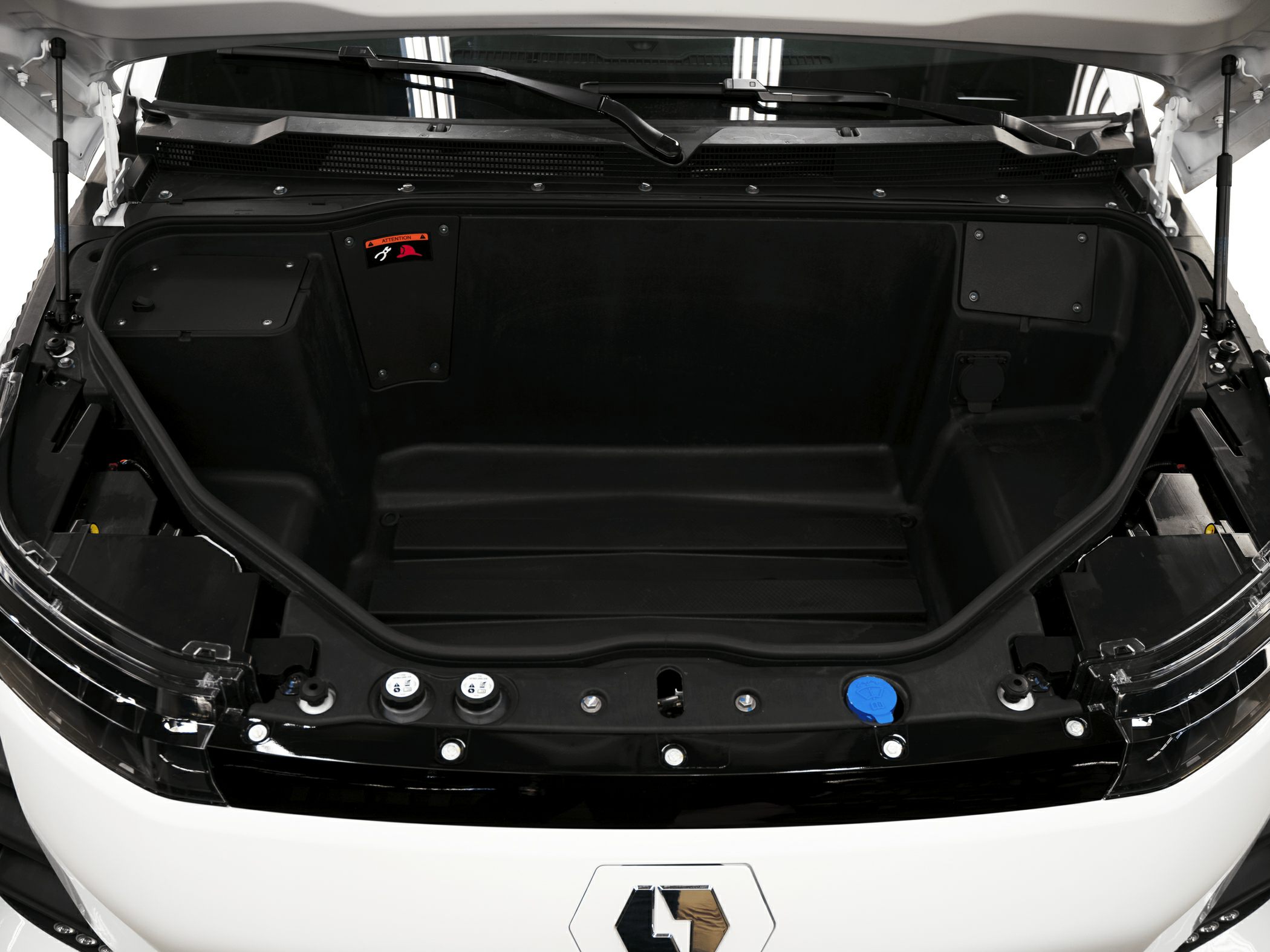 Spacious front trunk storage (frunk) in electric pickup.
