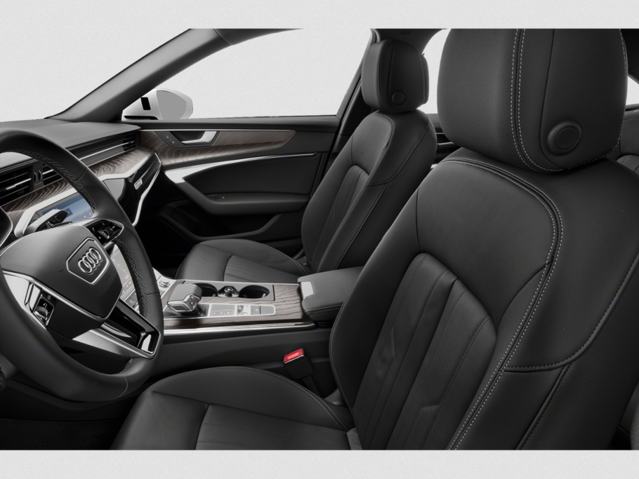 Premium leather seats with detailed stitching and modern dashboard with wood trim