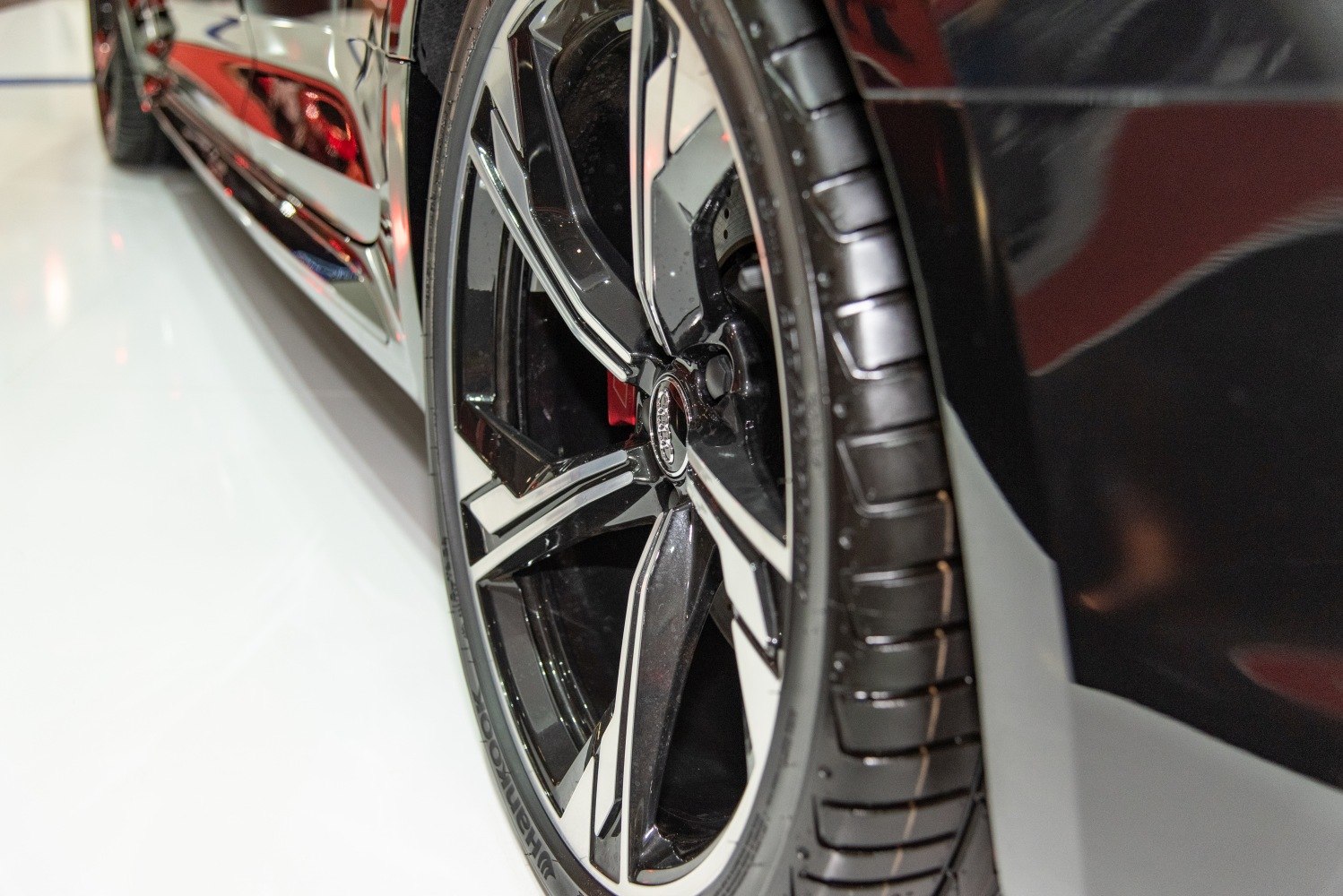 Close-up of alloy wheel with brake caliper and tire tread