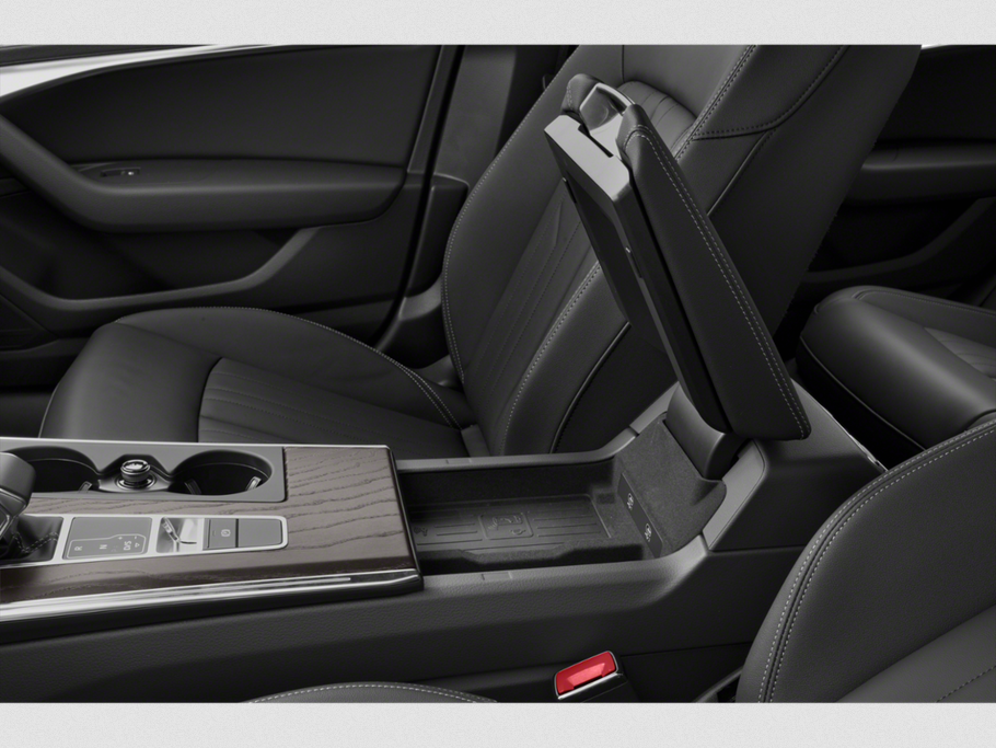 Center console with wood trim and open armrest storage compartment