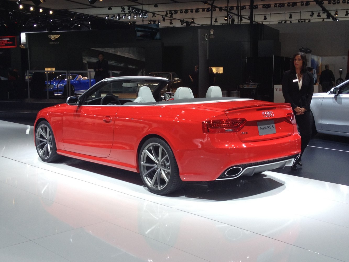 Red convertible with dual exhaust and alloy wheels