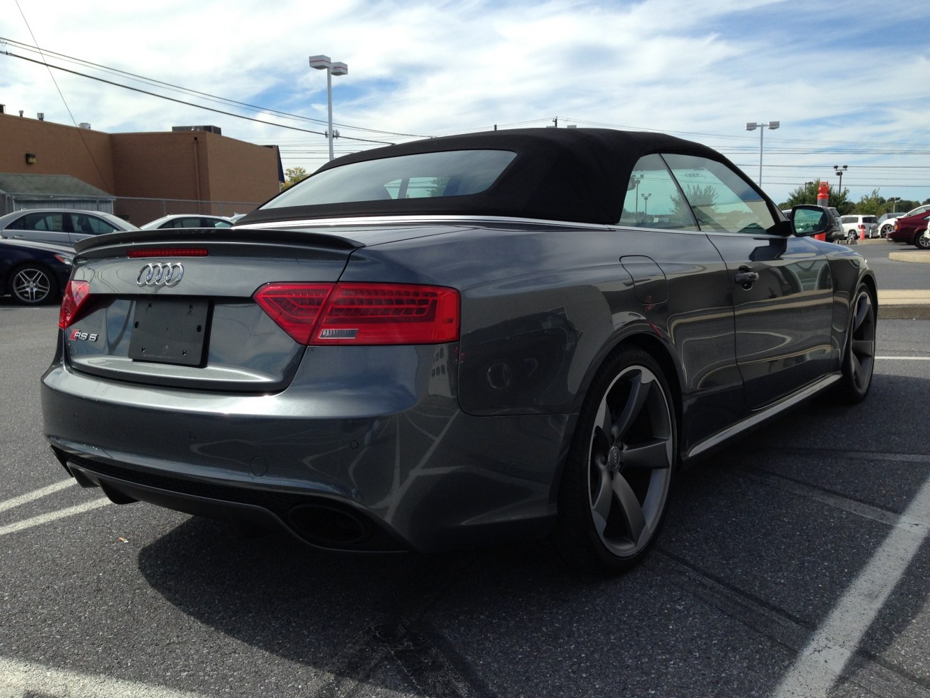 Rear view with black soft top and sporty taillights