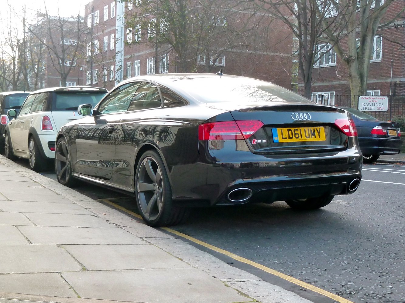 Rear view of a coupe with dual oval exhaust outlets