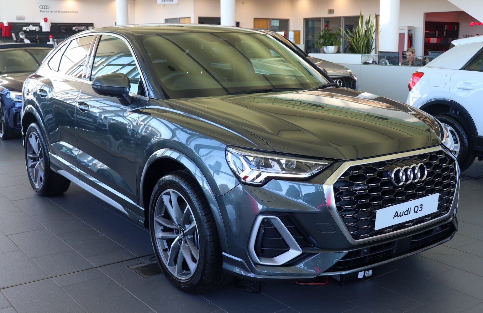 Front grille with honeycomb pattern and LED headlights