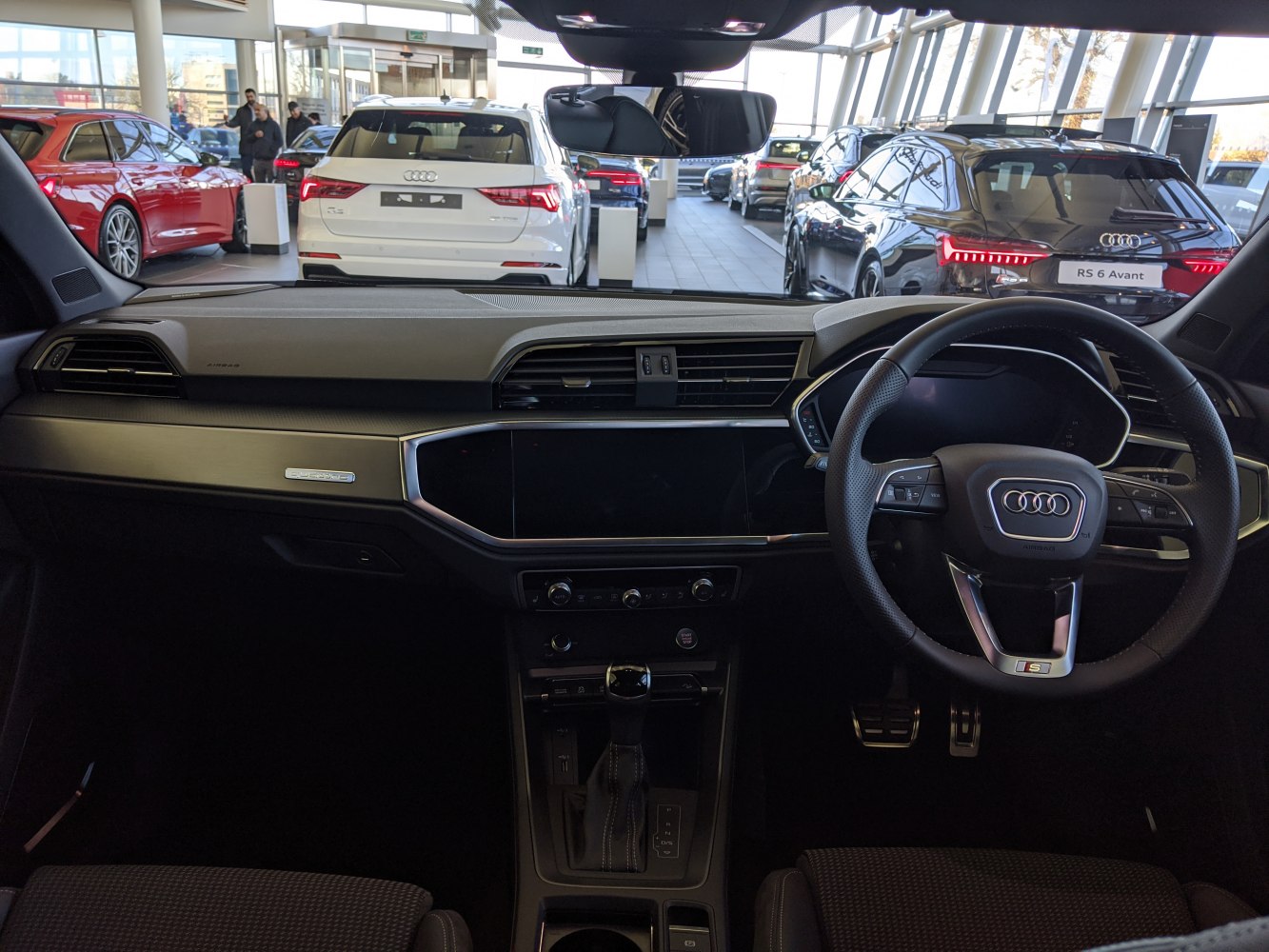 Modern dashboard and steering wheel with digital display and controls