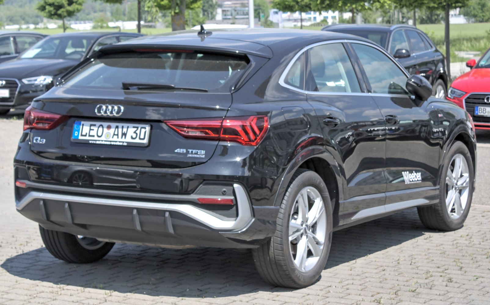 Rear view showing taillights and sporty design accents