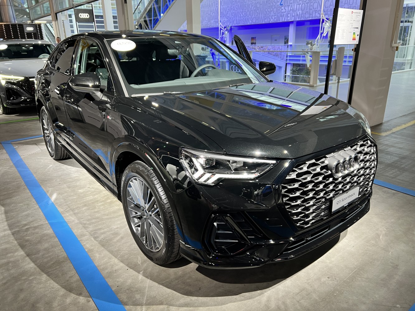 LED headlights with geometric front grille and alloy wheels