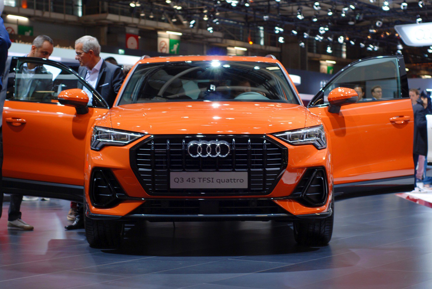Front view with bold grille and open front doors