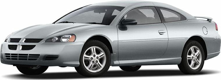 Silver two-door coupe with alloy wheels and round headlights