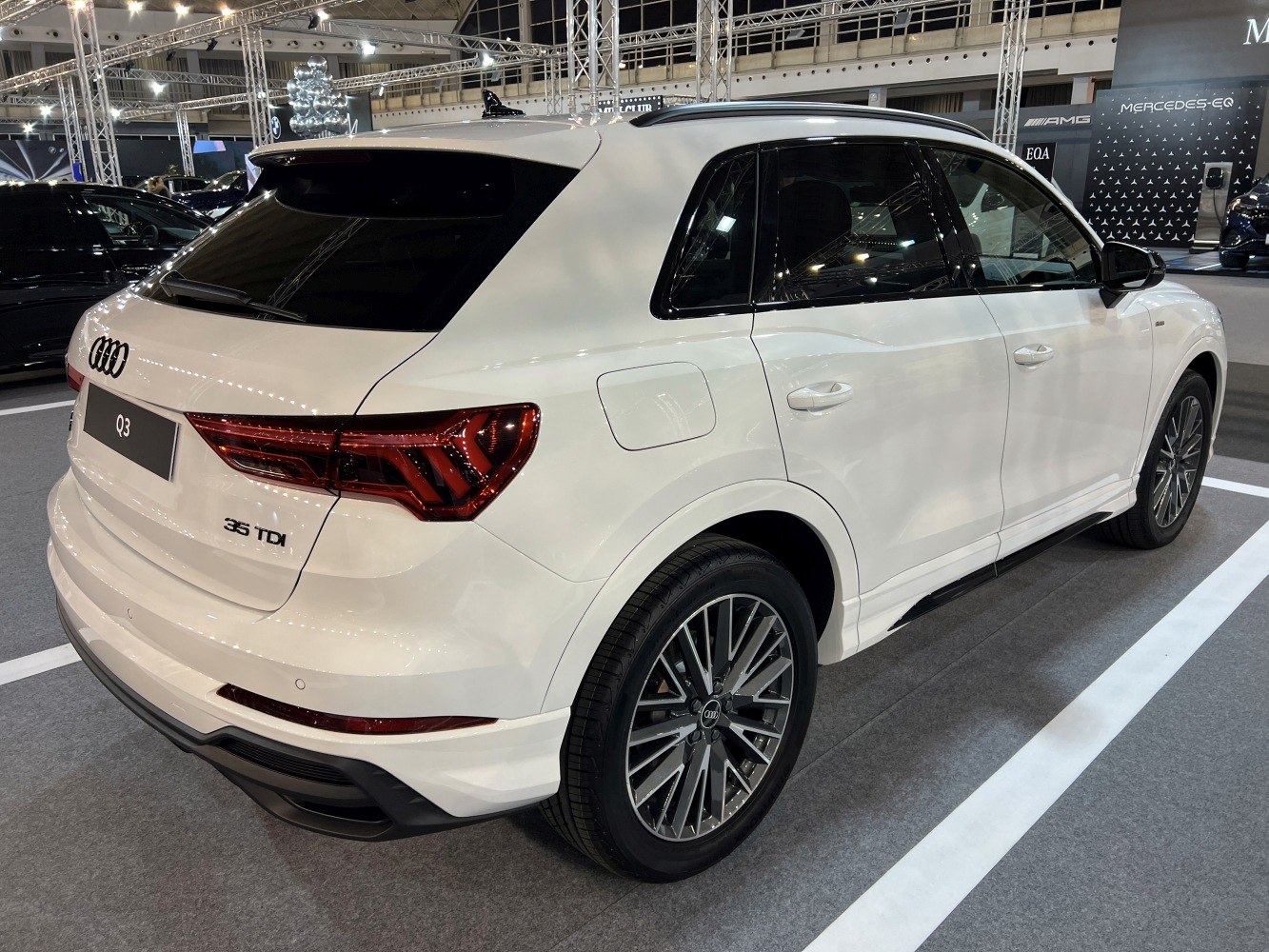 Rear and side view with taillights and distinctive wheel design