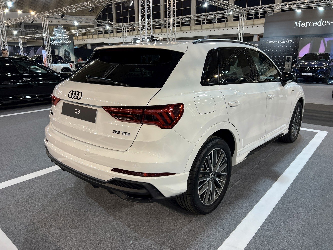 Rear view of white SUV with distinct LED tail lights and sporty alloy wheels