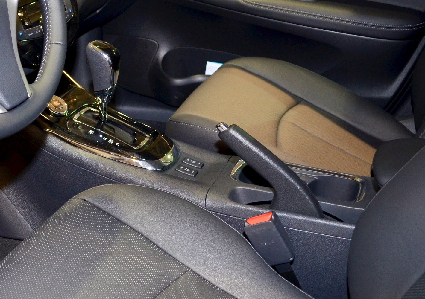 Automatic gear shift lever and handbrake in vehicle center console