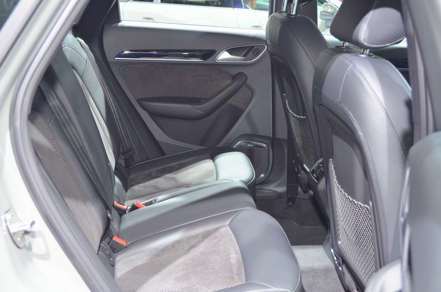Rear leather and suede seats with spacious legroom and sleek door panel