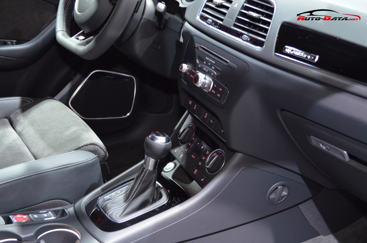 Center console with gear shifter and climate control knobs.