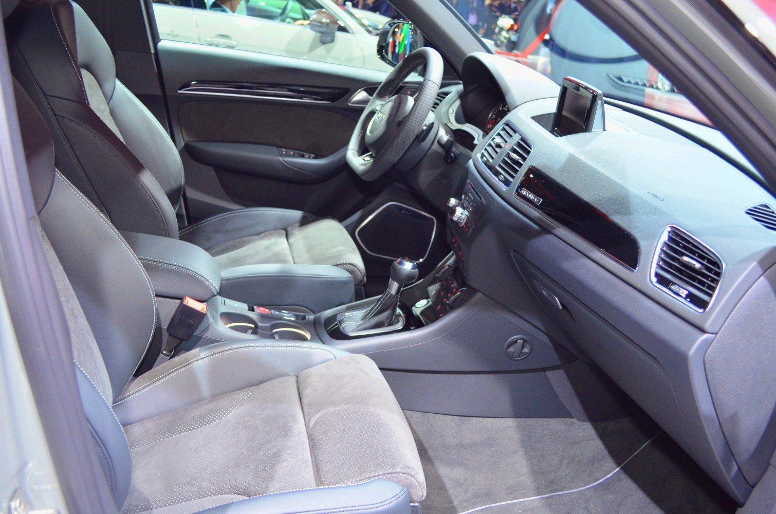 Dashboard, steering wheel, and front seats of a modern vehicle interior