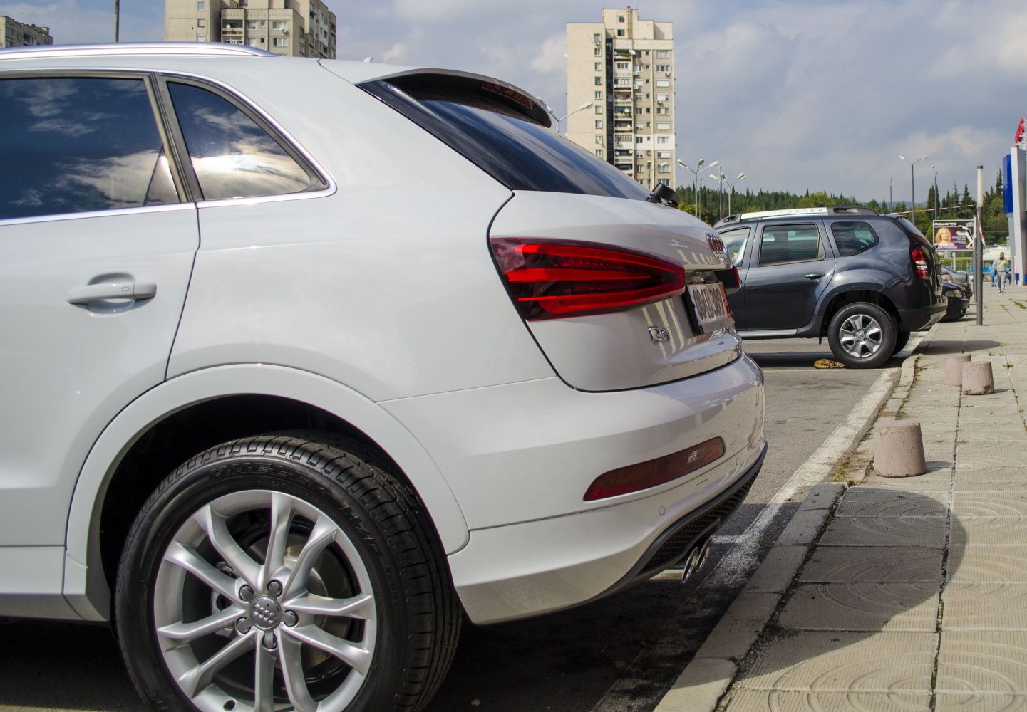 Rear view with tail lights and alloy wheel detail of a compact SUV