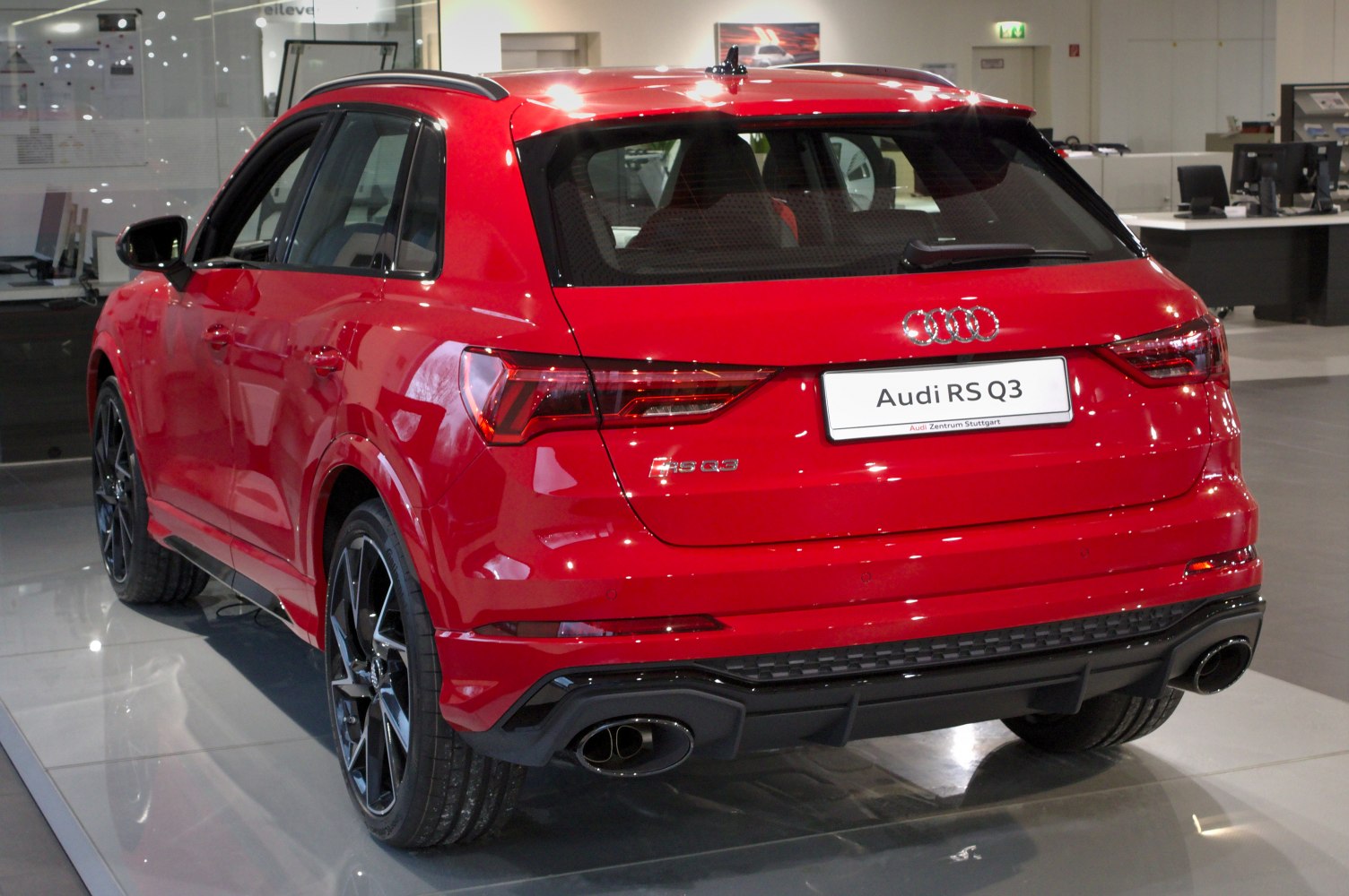 Red SUV rear with LED taillights and dual oval exhaust pipes