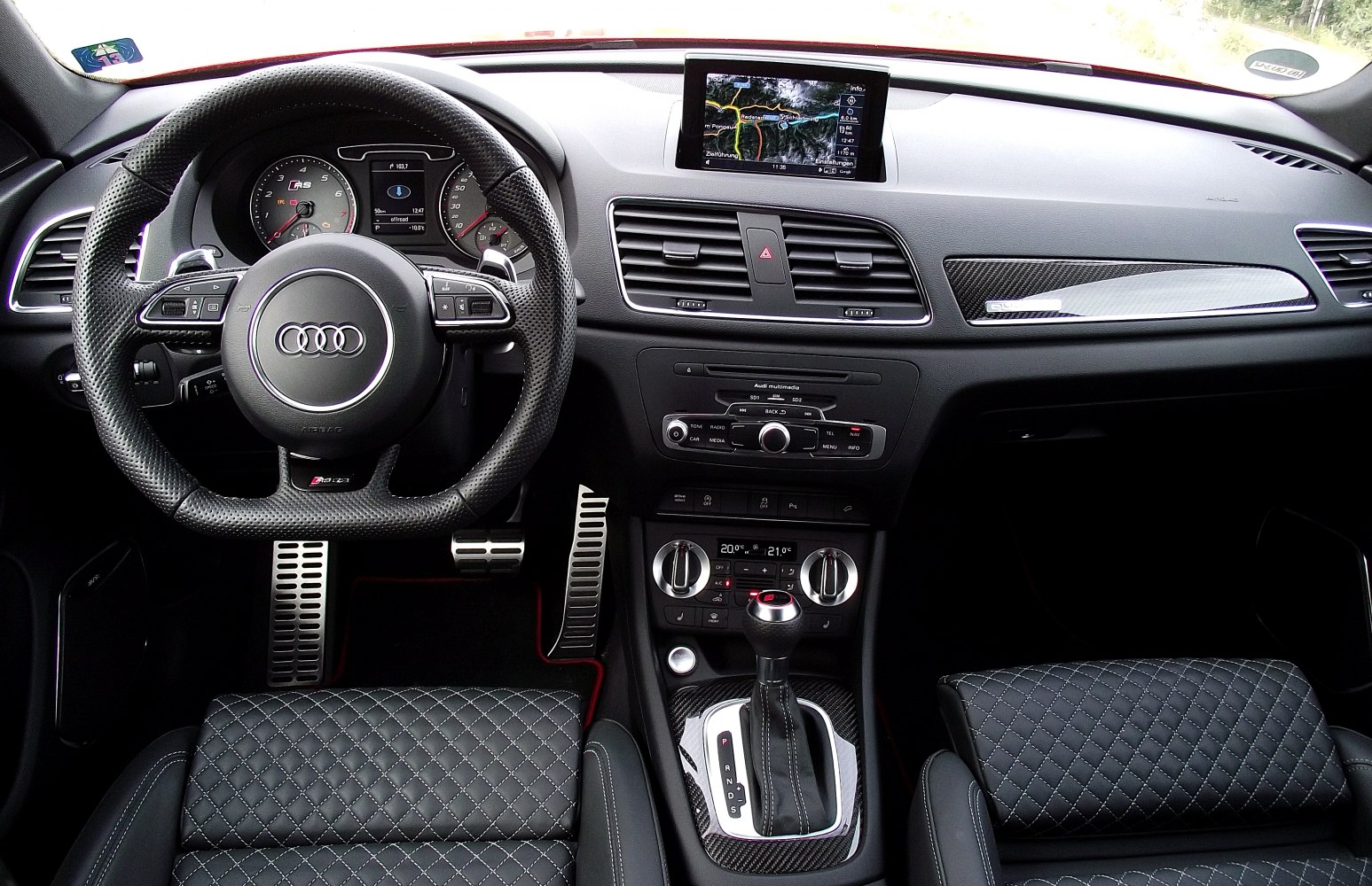 Audi RS Q3 2013 interior with steering wheel, dashboard, and gear shift