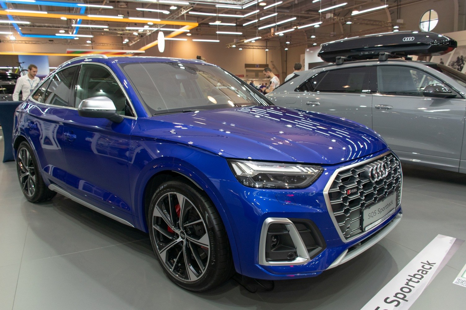 Blue luxury SUV with honeycomb grille and sporty alloy wheels