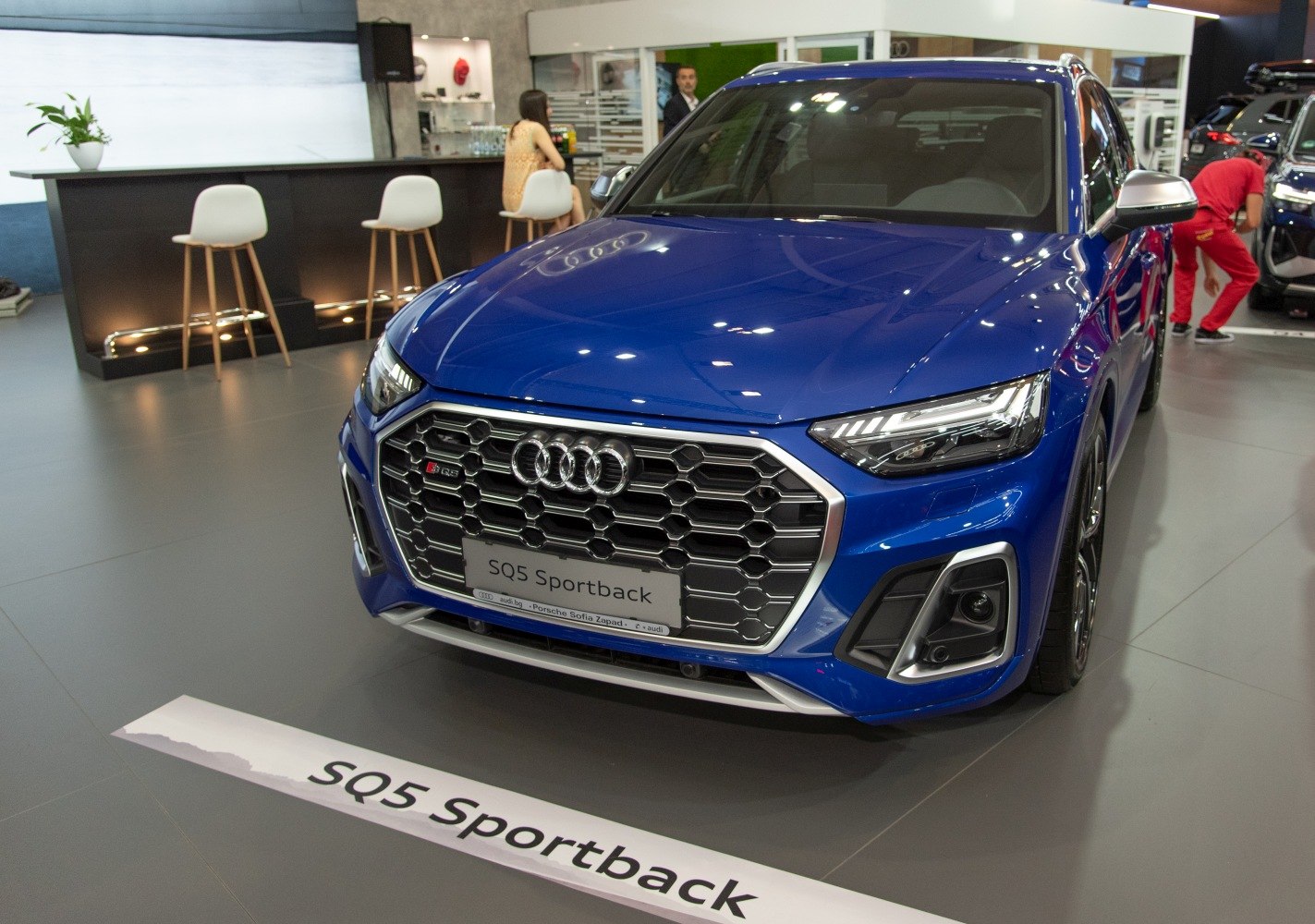 Front grille and headlights of a blue luxury SUV