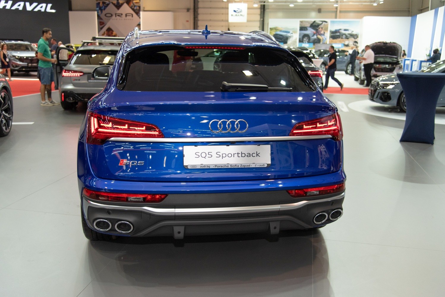 Blue SUV rear with LED taillights and quad exhausts