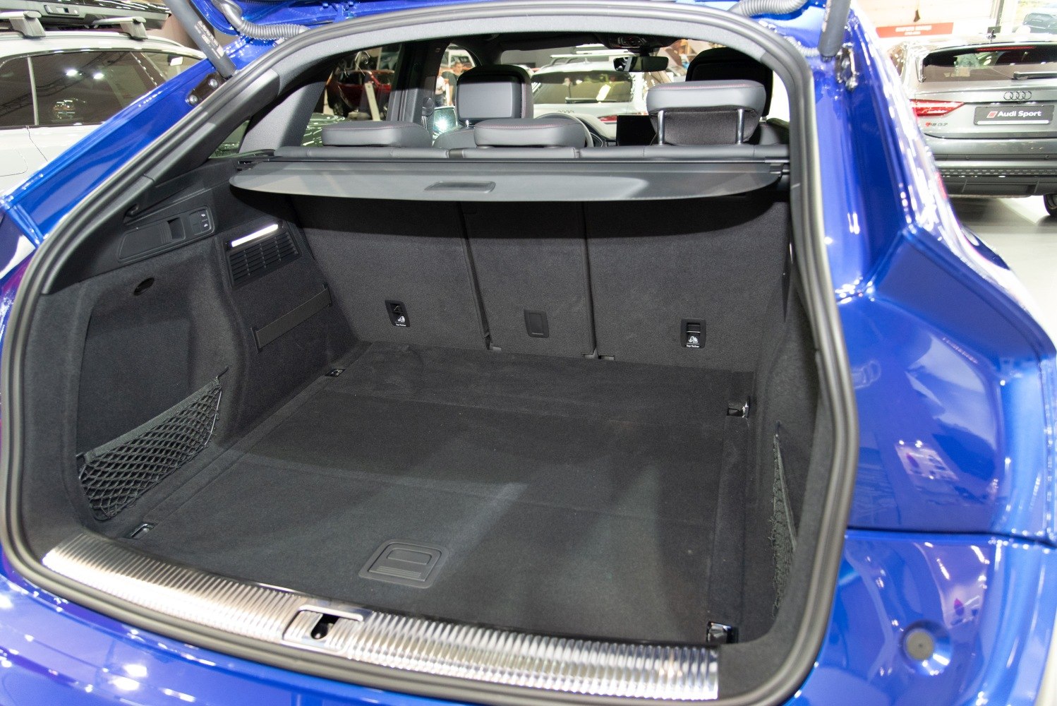 Spacious trunk cargo area with retractable cover and side net compartments