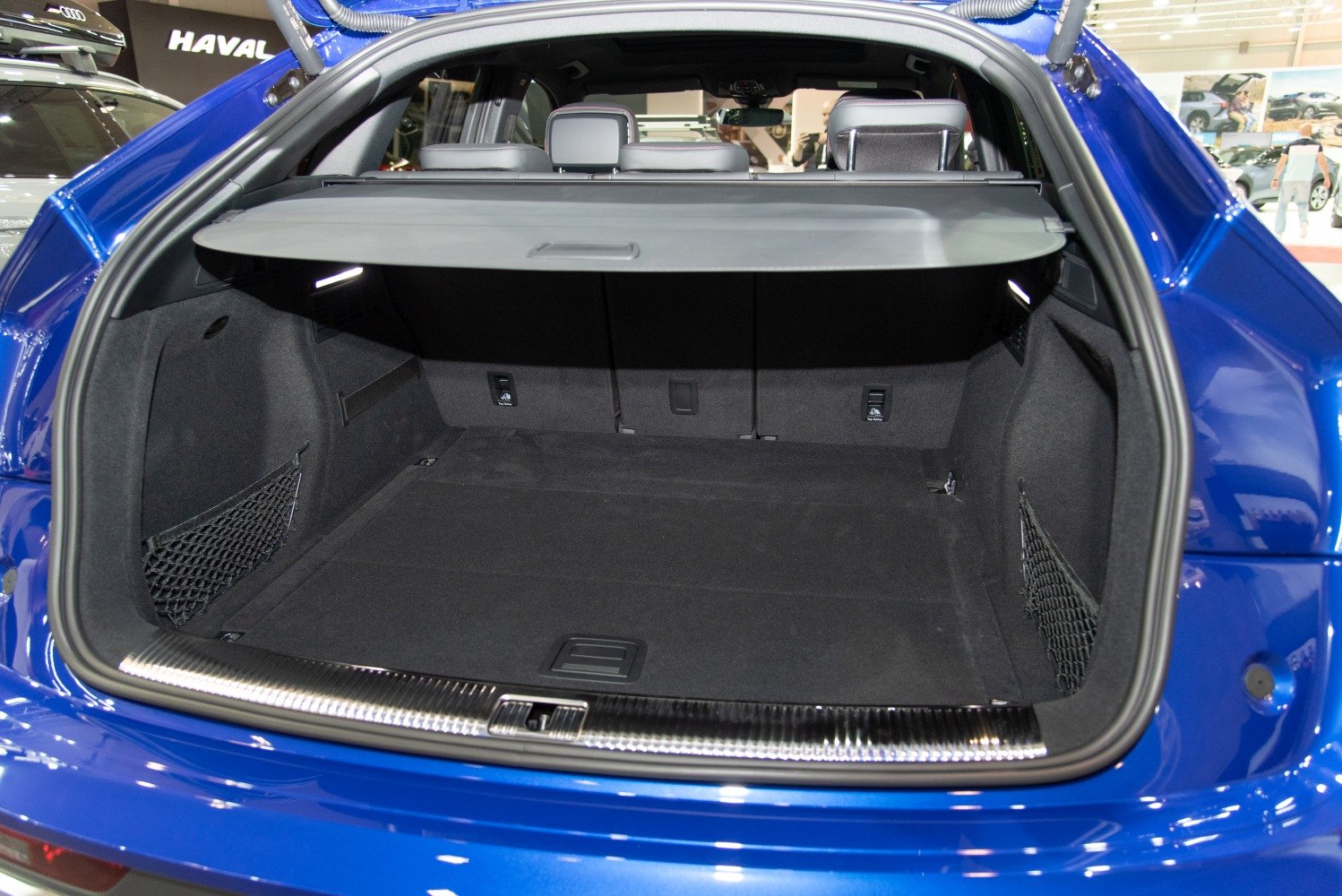 Spacious and organized trunk interior with cargo cover and net pockets.