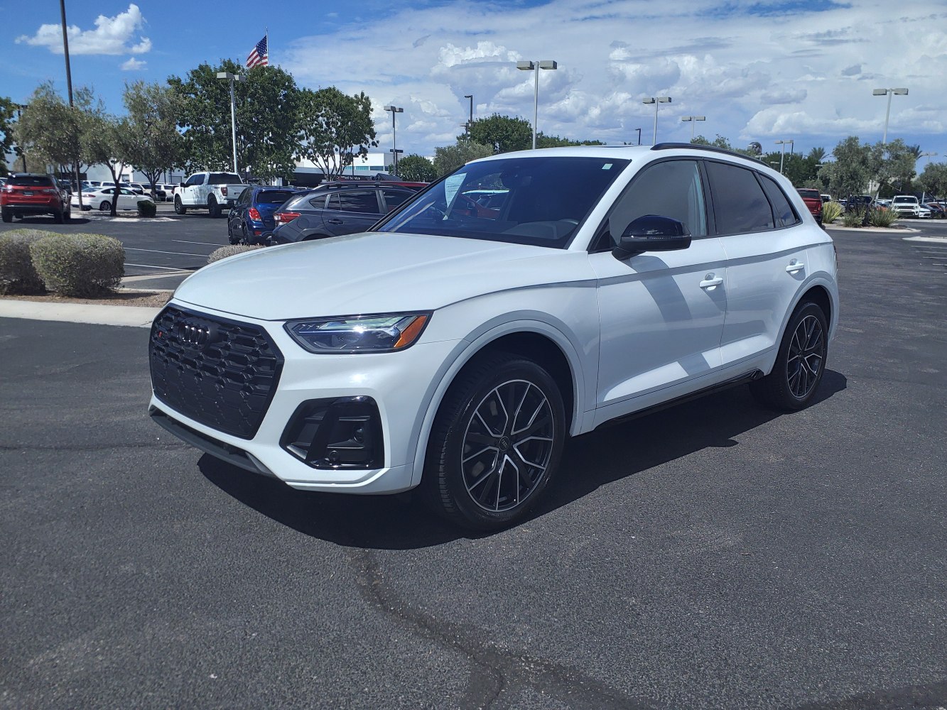 White SUV with black grille, LED headlights, and alloy wheels
