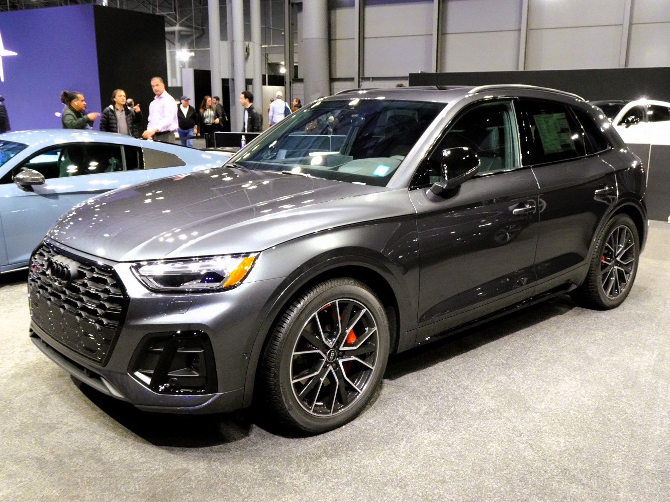 Sporty SUV with black honeycomb grille and alloy wheels.