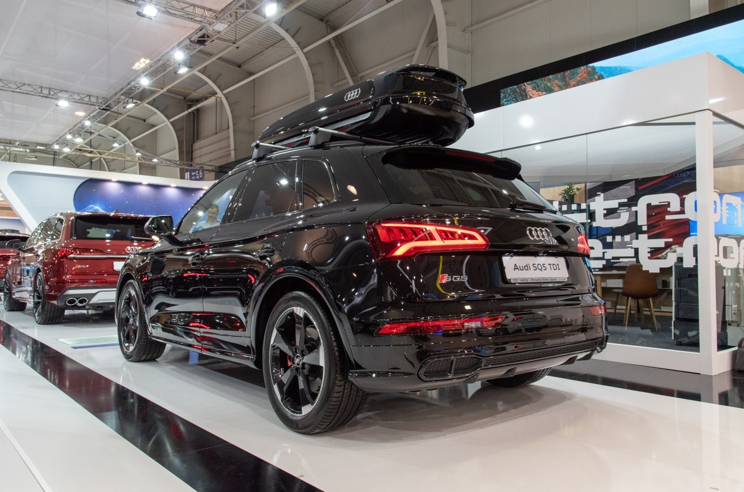 Rear view of SUV with LED taillights and roof cargo box