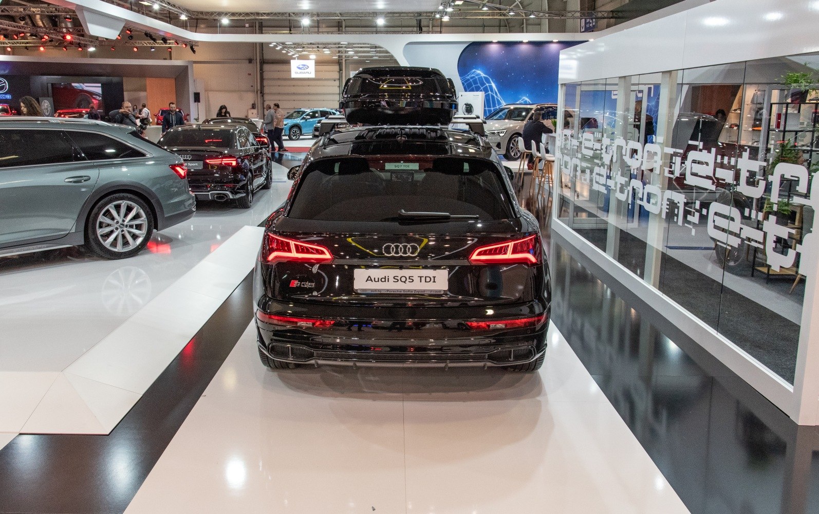 Rear view with LED tail lights and roof box