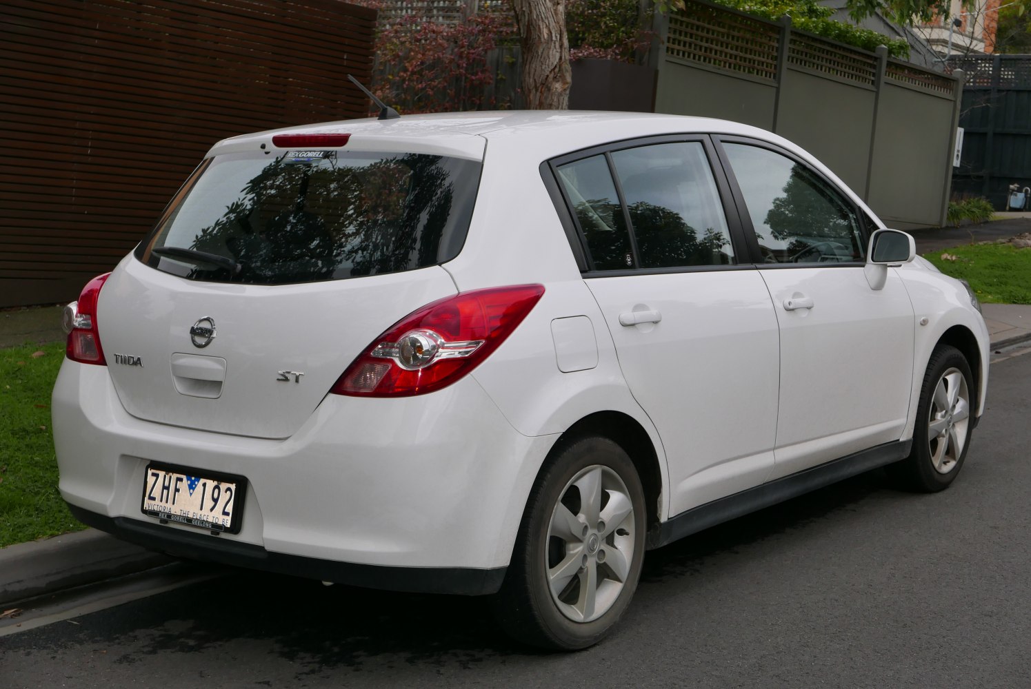 Rear and side view of white five-door hatchback with prominent tail lights