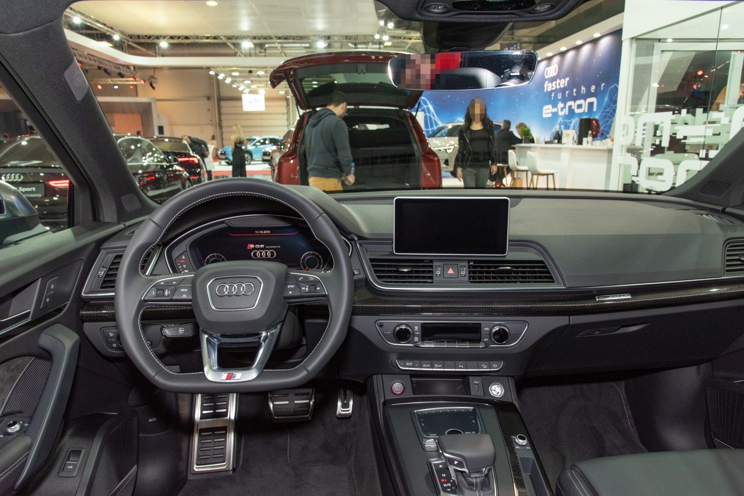Modern dashboard and steering wheel with digital display and controls