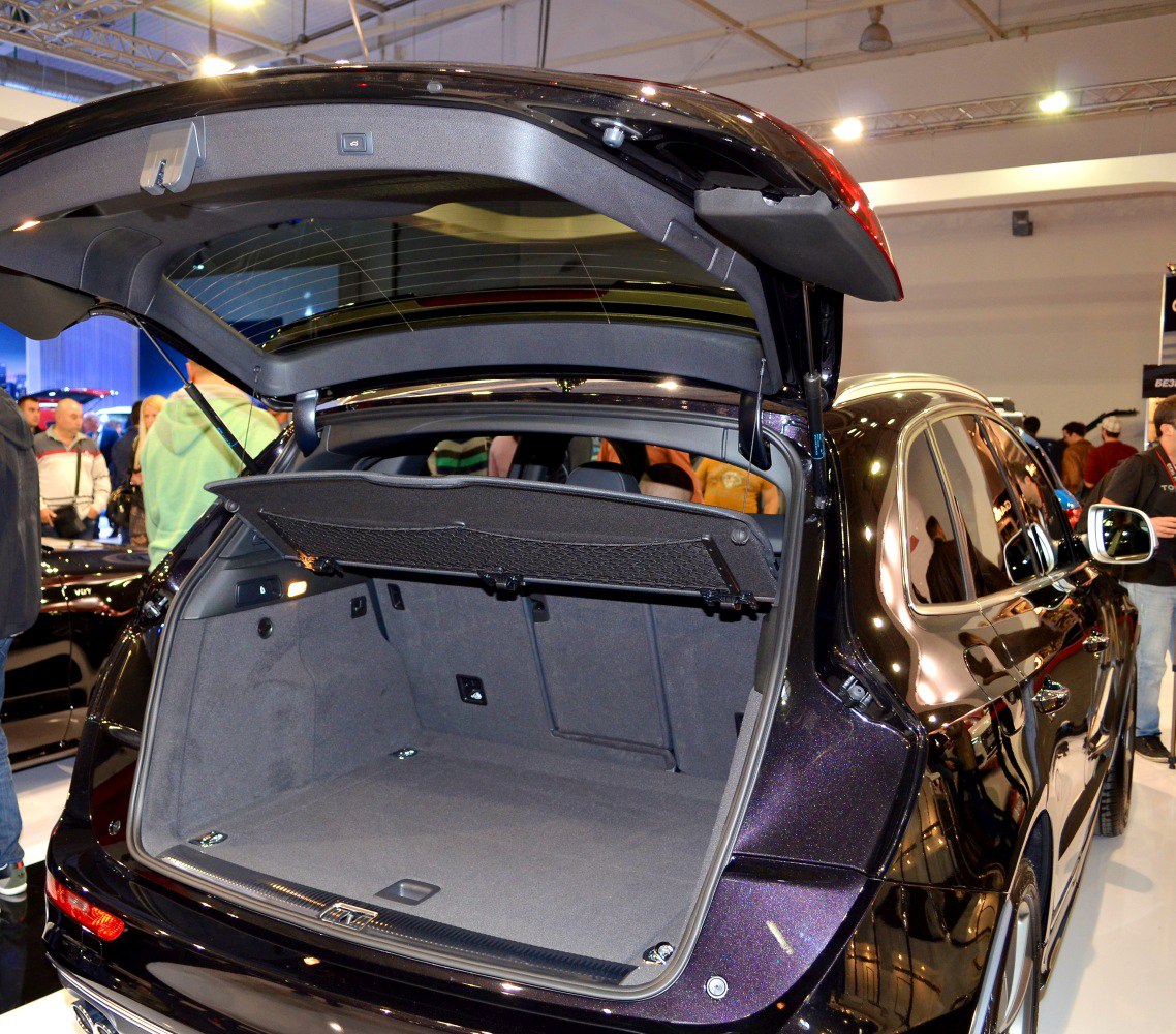 Spacious SUV trunk with retractable cargo cover and open tailgate