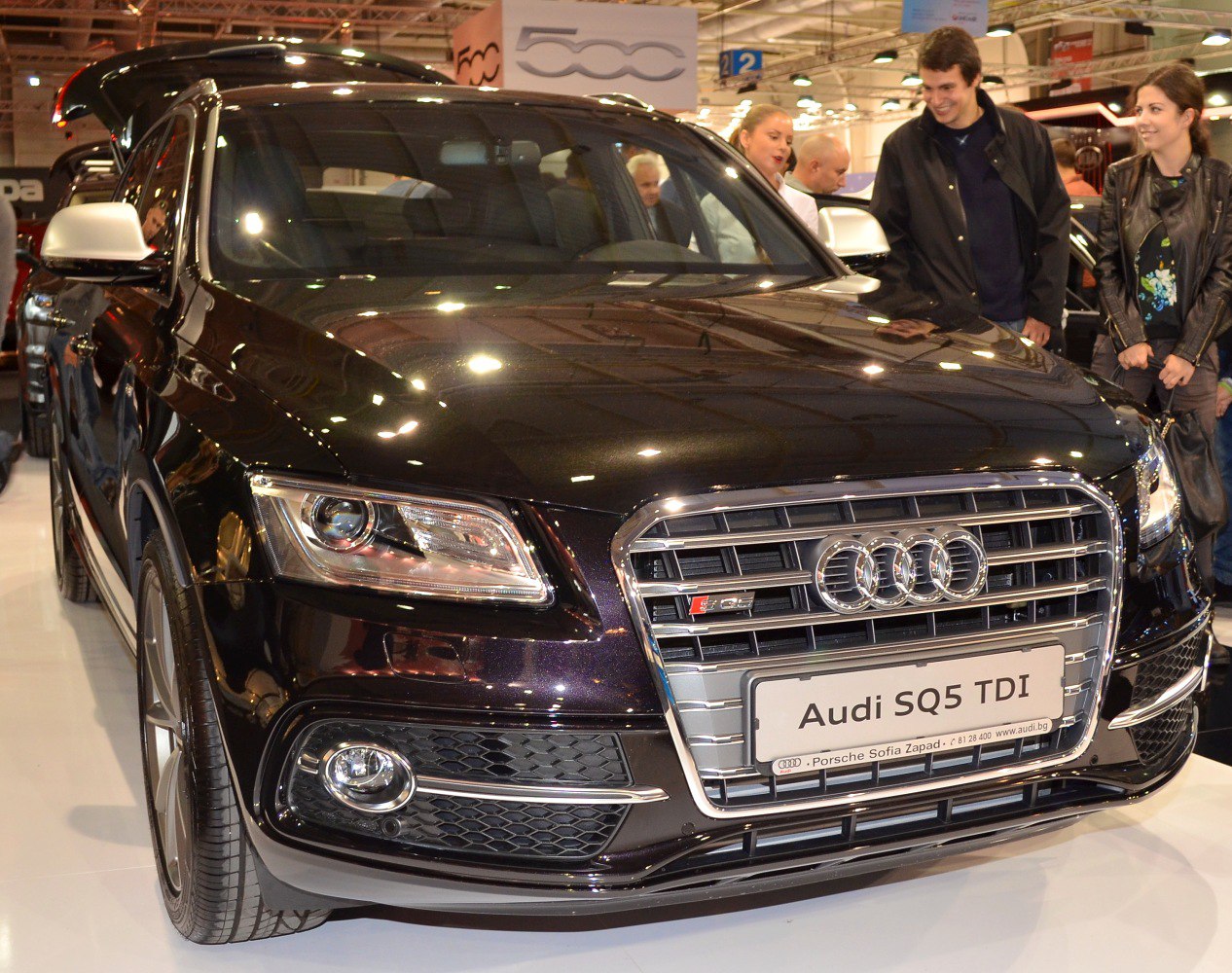 Front view with grille, headlights, fog lamps of a black SUV