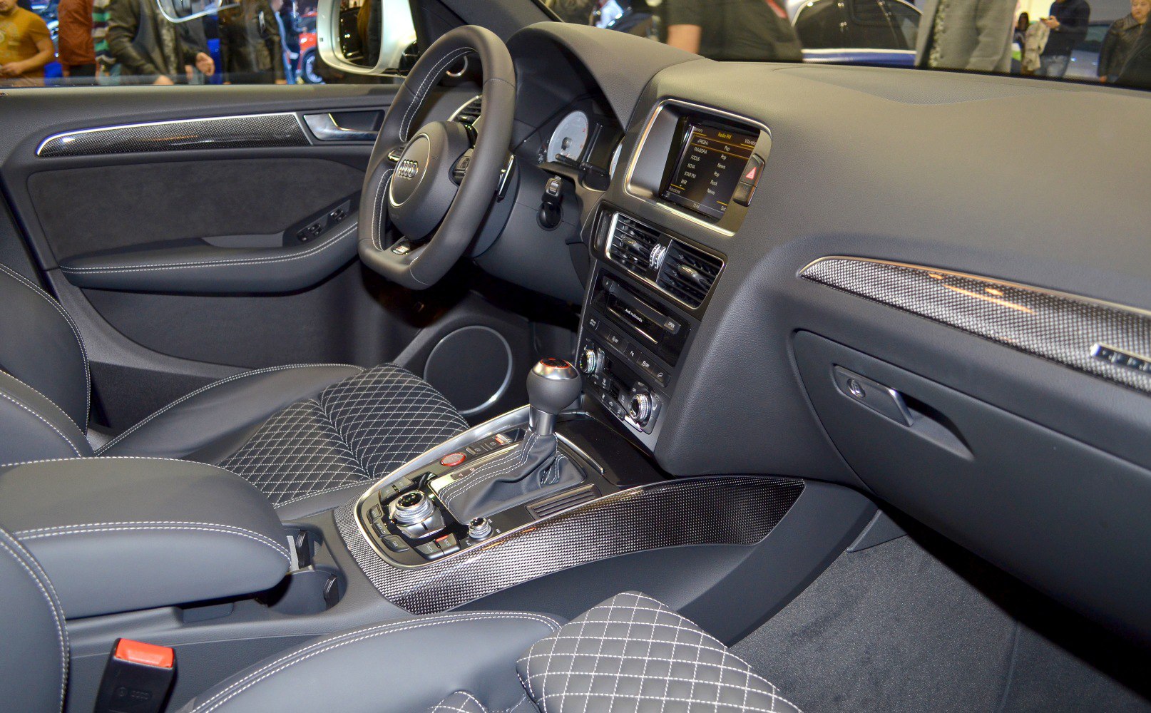 Luxury interior with leather seats, carbon fiber trim, and advanced infotainment