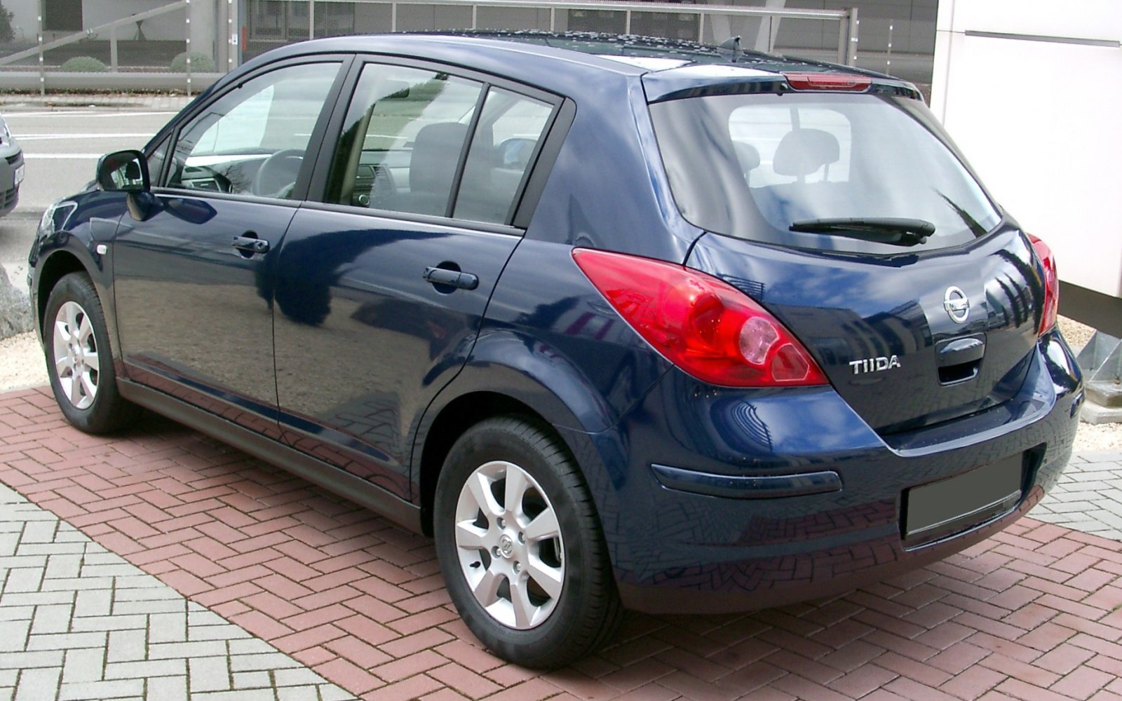 Compact hatchback rear view with distinctive taillights and rear wiper