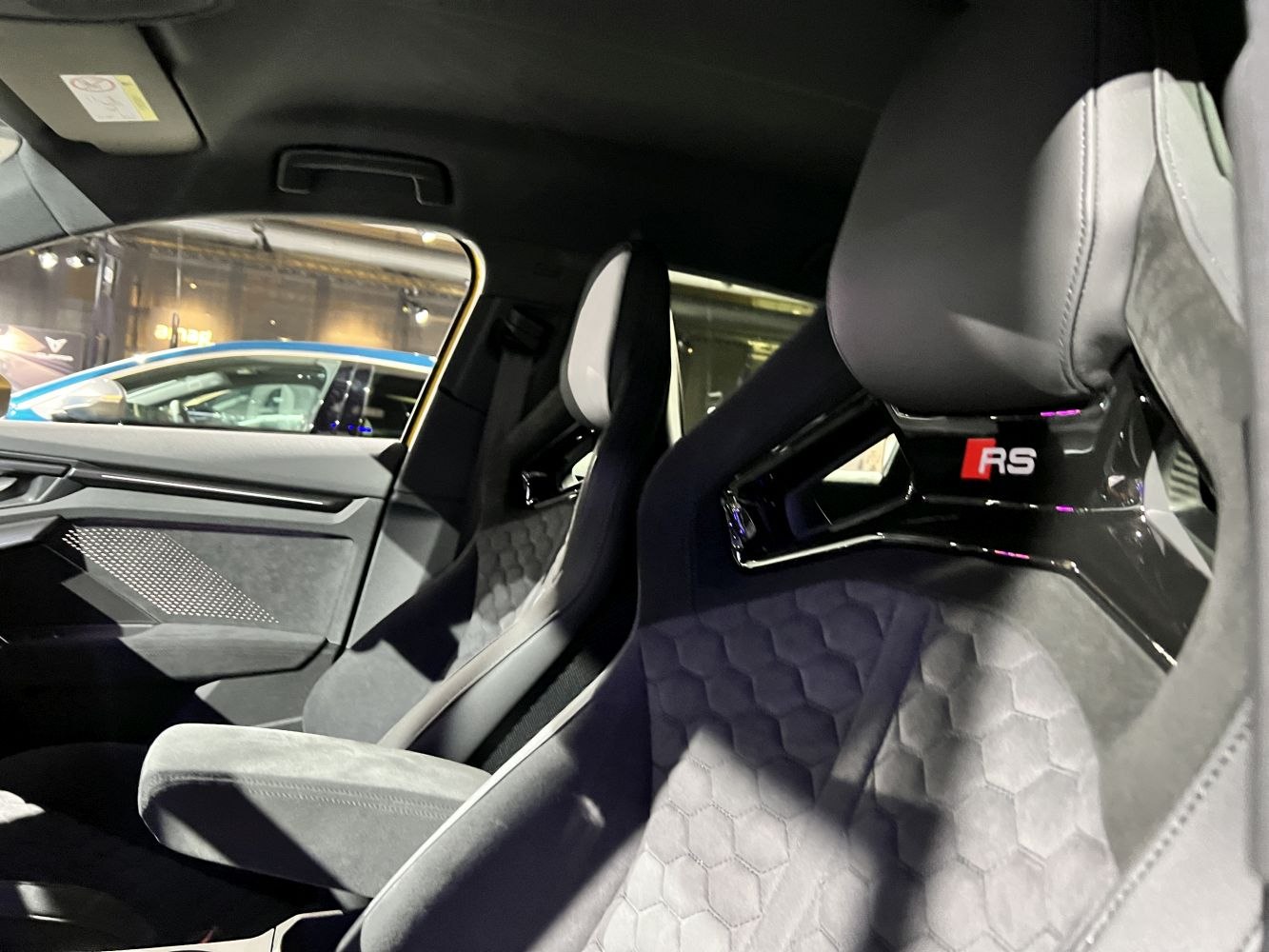Close-up of premium sports seats with RS logo and hex pattern upholstery