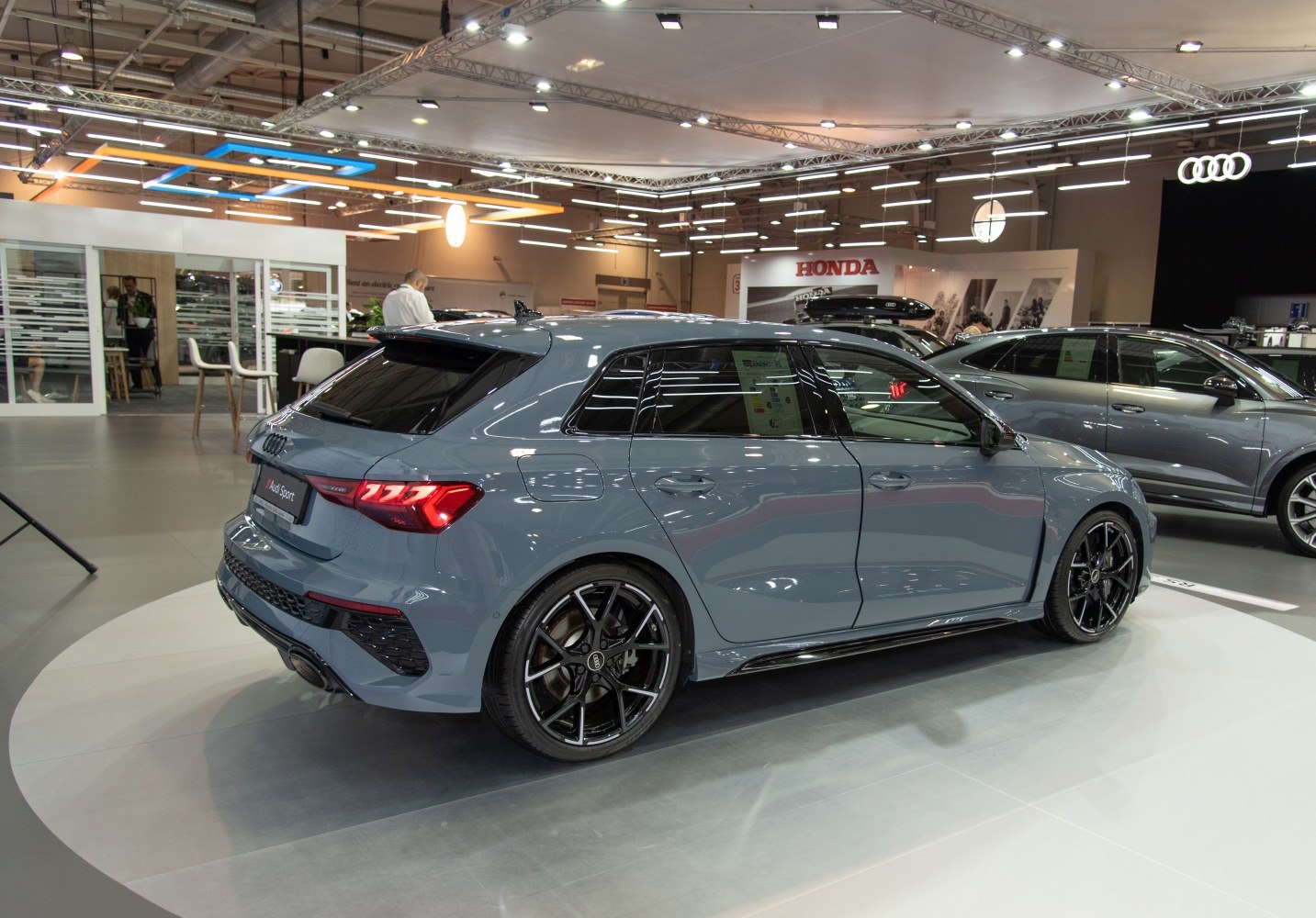 Rear side profile with black alloy wheels and LED taillights