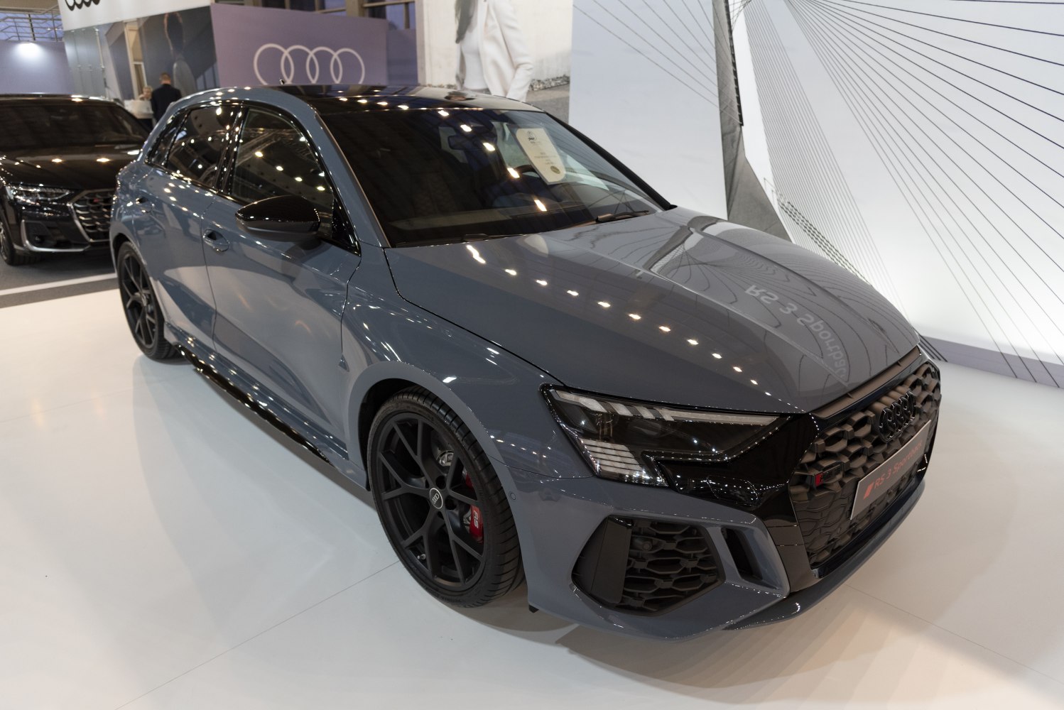Front and side profile with black grille and alloy wheels