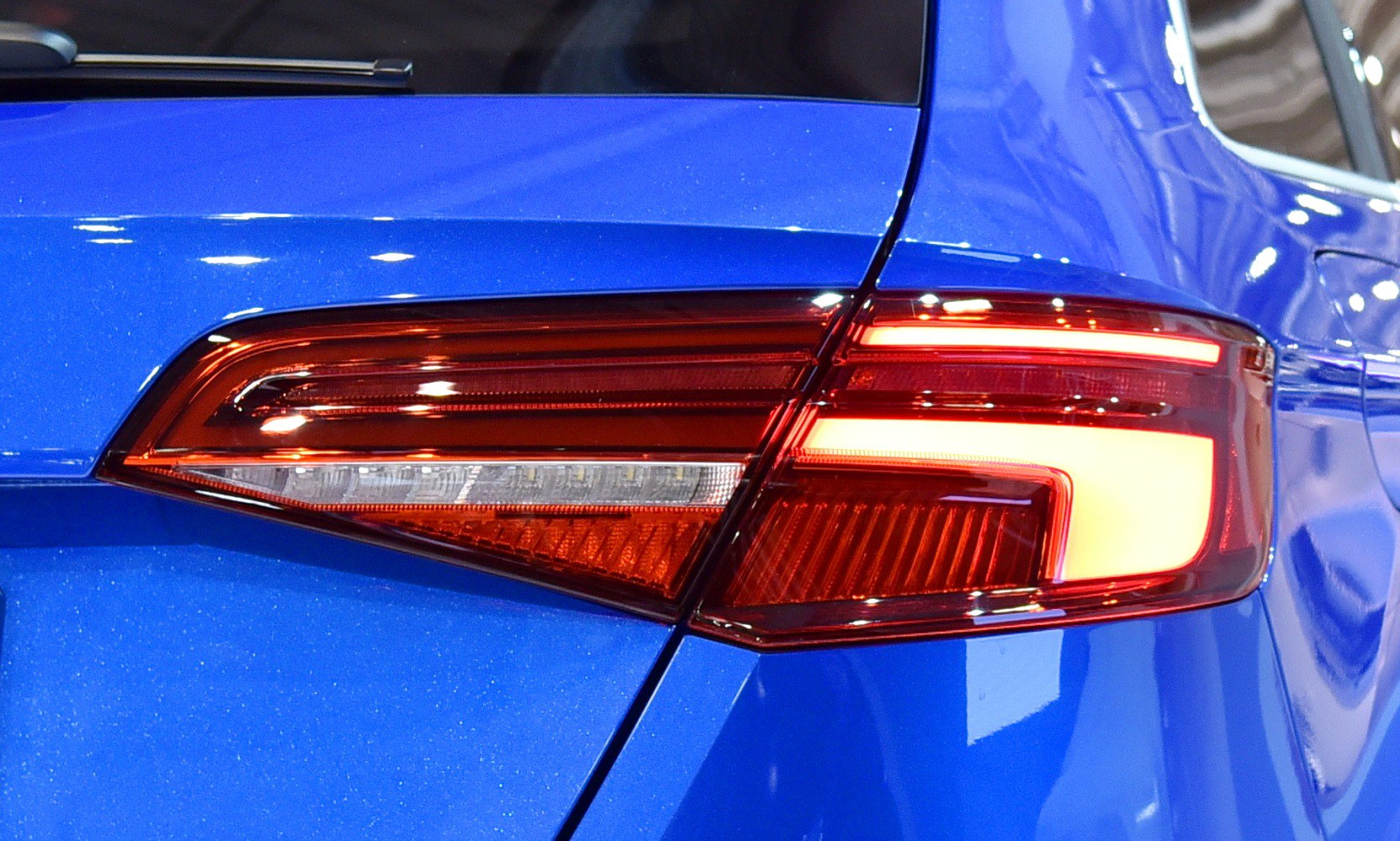 Close-up of rear taillight with LED elements on blue hatchback