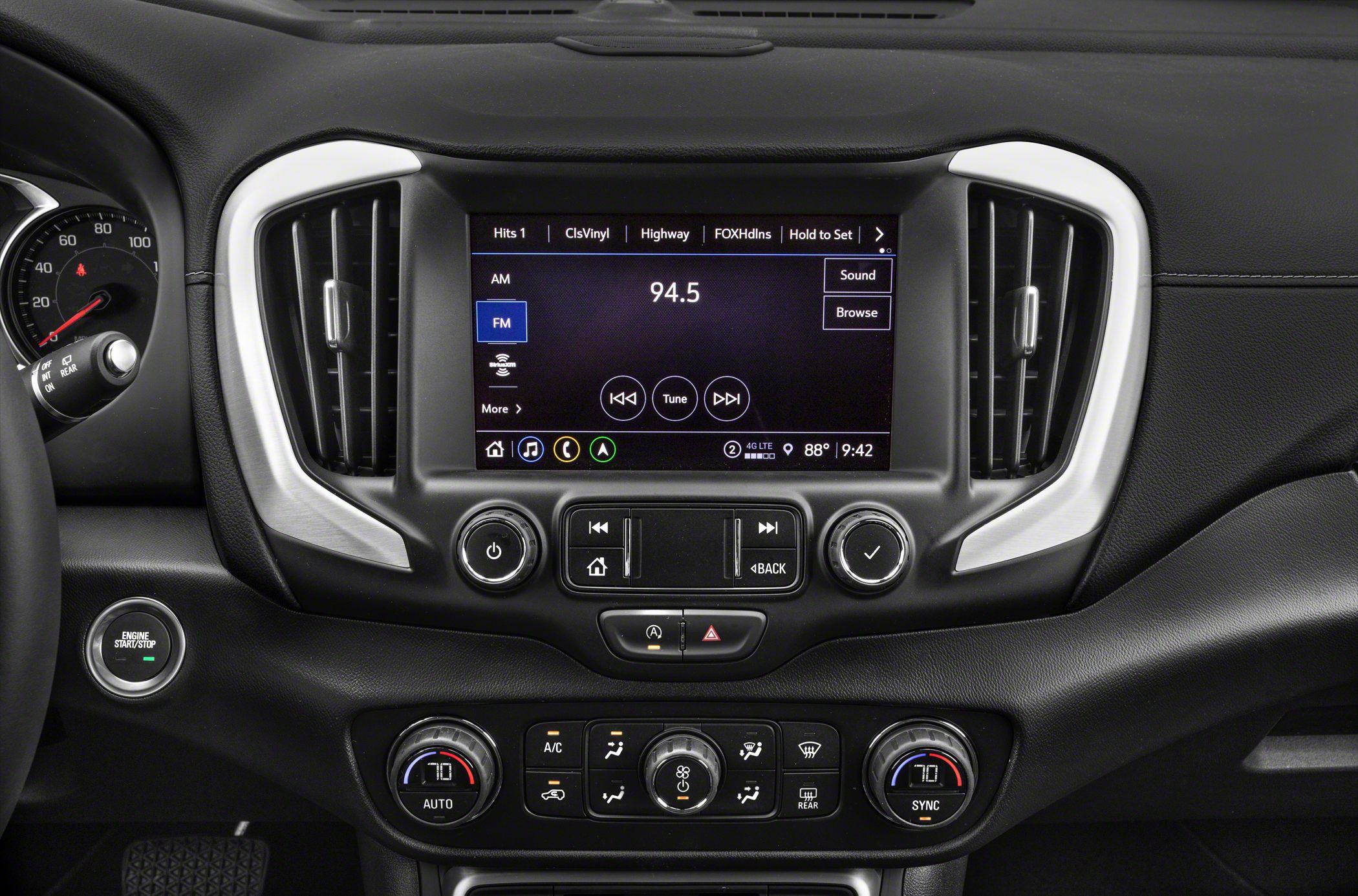 Touchscreen infotainment system and dual-zone climate controls in car dashboard