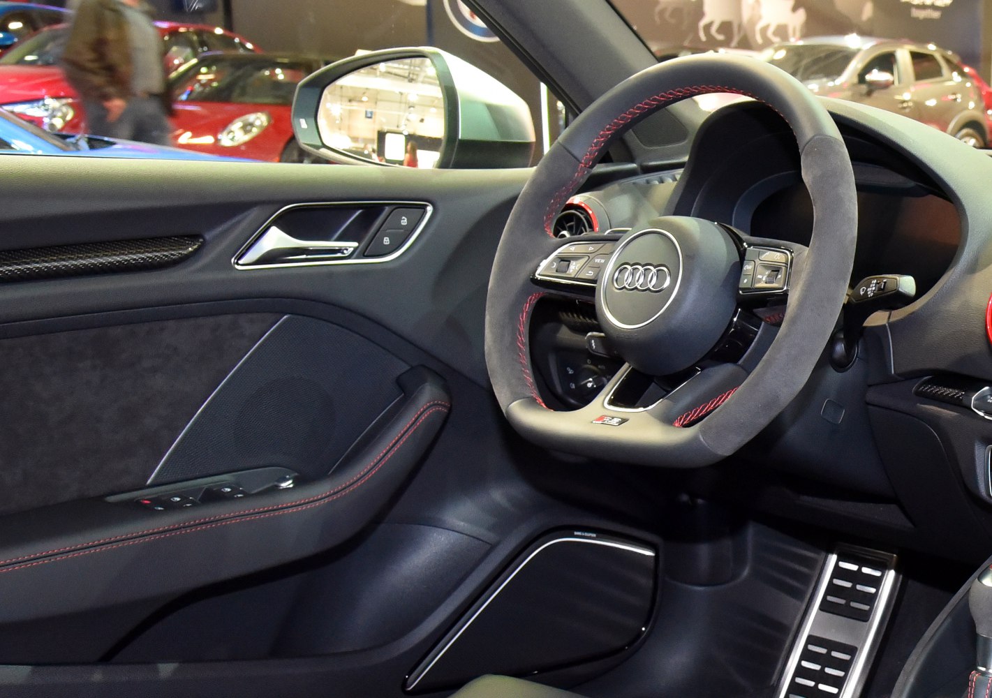 Sport steering wheel and door panel with premium finishes