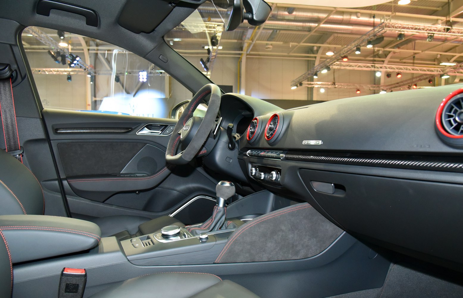 Sporty interior with red stitching and round air vents